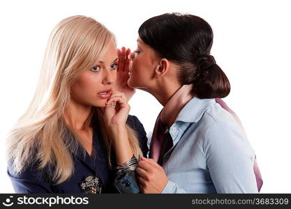 couple of young woman blond and brunette in act to whispering a secret