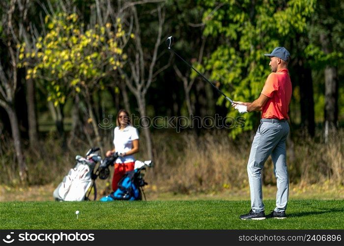 Couple on a golfing vacation, beautiful sunny weather