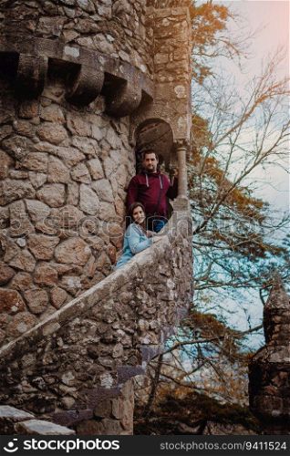 Couple on a medieval tower from Quinta da Regaleira in Sintra, Portugal