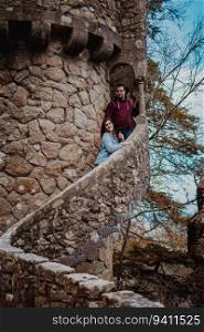 Couple on a medieval tower from Quinta da Regaleira in Sintra, Portugal