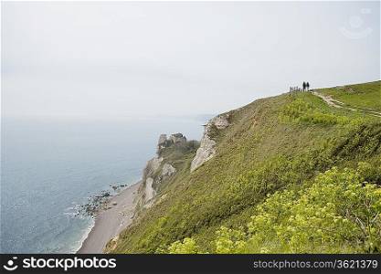 Couple on a Path Atop a Cliff