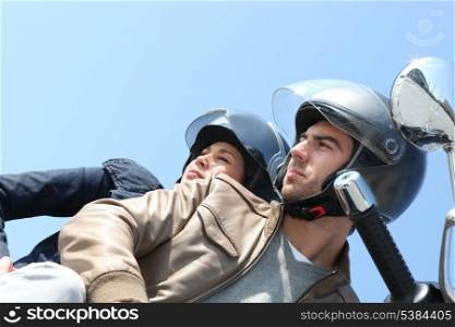 Couple on a scooter outdoors