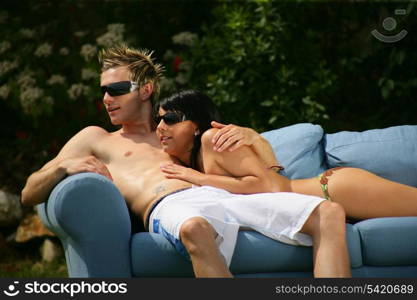 Couple on a sofa outdoors