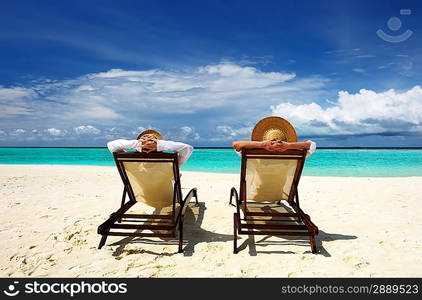 Couple on a tropical beach at Maldives