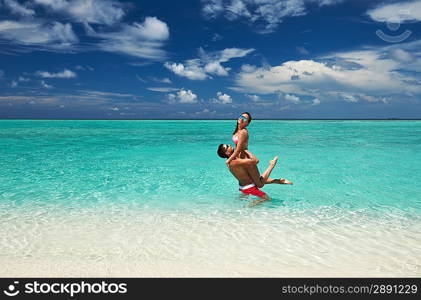 Couple on a tropical beach at Maldives