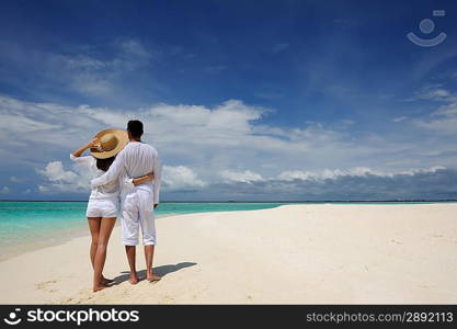 Couple on a tropical beach at Maldives