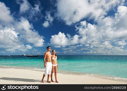 Couple on a tropical beach at Maldives