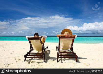 Couple on a tropical beach at Maldives