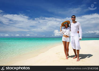 Couple on a tropical beach at Maldives