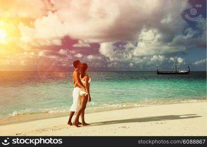 Couple on a tropical beach at Maldives