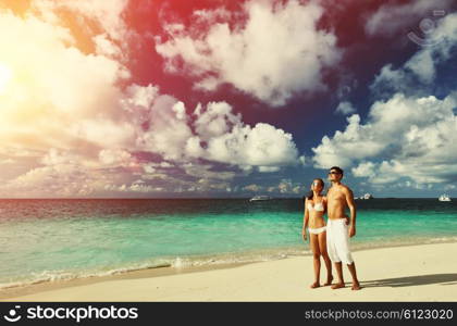 Couple on a tropical beach at Maldives