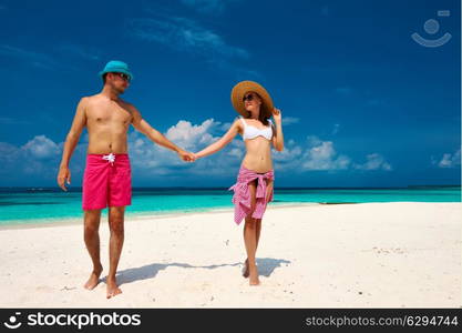 Couple on a tropical beach at Maldives