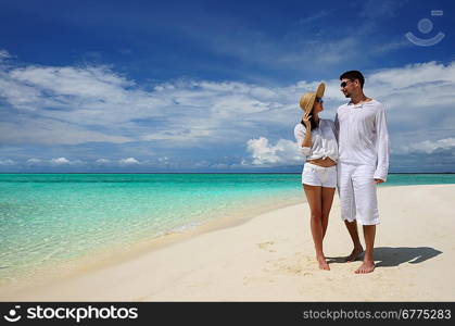 Couple on a tropical beach at Maldives