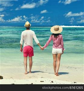 Couple on a tropical beach at Seychelles