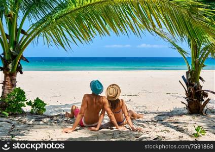 Couple on a tropical beach at Tioman Island, Malaysia