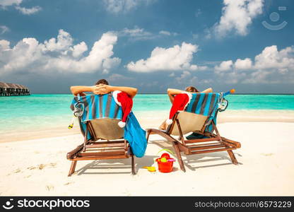 Couple on a tropical beach in Maldives at christmas