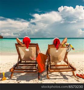 Couple on a tropical beach in Maldives at christmas