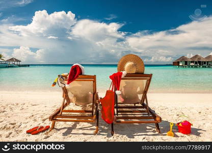 Couple on a tropical beach in Maldives at christmas