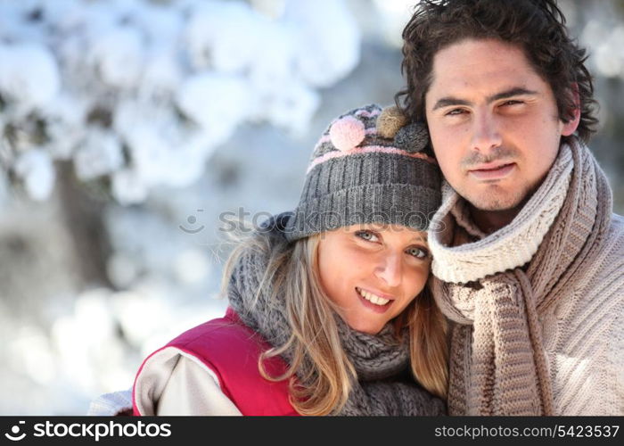 Couple on a winter walk through the snow