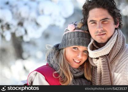 Couple on a winter walk through the snow