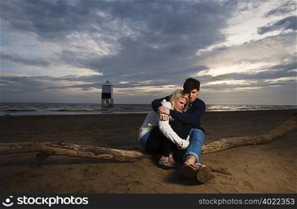 Couple on beach at sunset