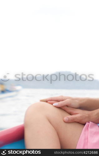 Couple on Boat Clasping Hands