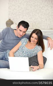 couple on couch with computer