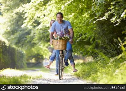 Couple On Cycle Ride In Countryside