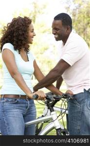 Couple On Cycle Ride in Park