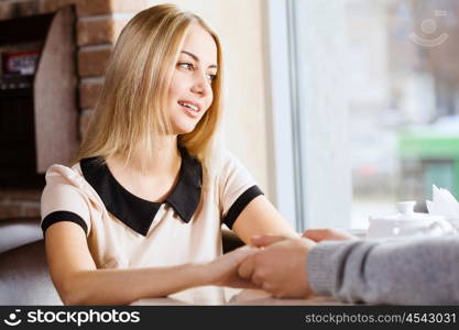 Couple on date. Young attractive lady having date at cafe