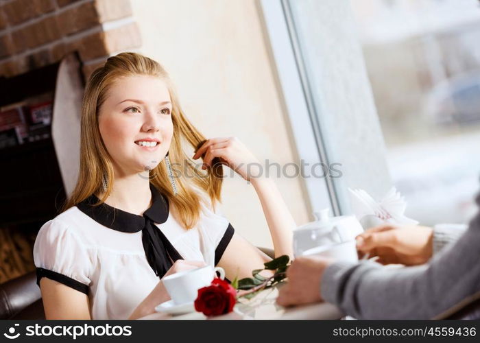 Couple on date. Young attractive lady having date at cafe