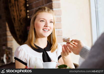 Couple on date. Young attractive lady having date at cafe