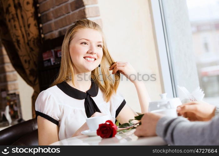 Couple on date. Young attractive lady having date at cafe