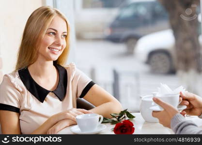 Couple on date. Young attractive lady having date at cafe