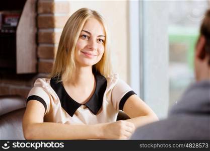 Couple on date. Young attractive lady having date at cafe