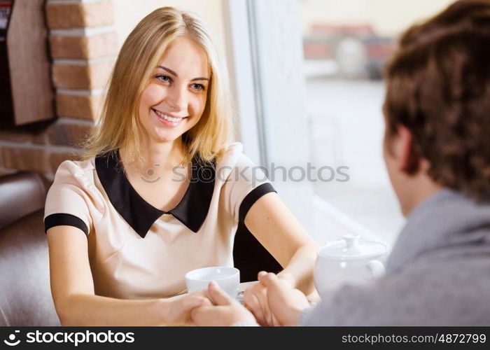 Couple on date. Young attractive lady having date at cafe