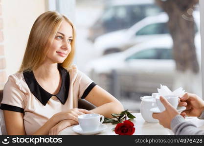 Couple on date. Young attractive lady having date at cafe