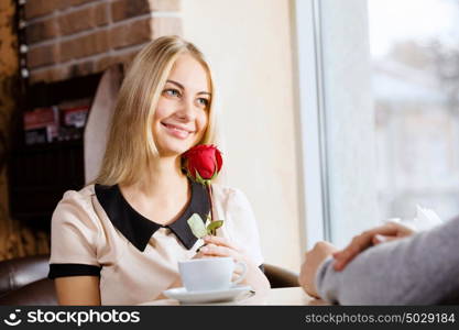 Couple on date. Young attractive lady having date at cafe