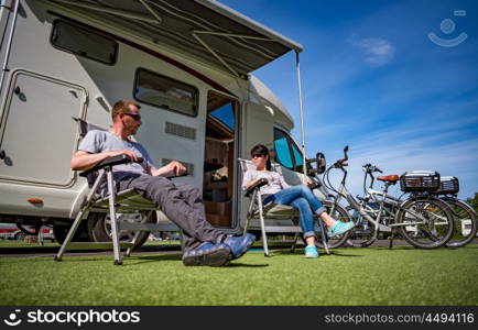 Couple on holiday at a campsite. Caravan car Vacation. Family vacation travel, holiday trip in motorhome