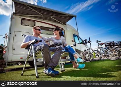 Couple on holiday at a campsite. Caravan car Vacation. Family vacation travel, holiday trip in motorhome. Tourism vacation and traveling.