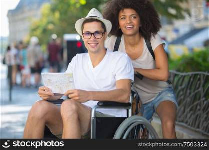 Couple on holiday, man in wheelchair