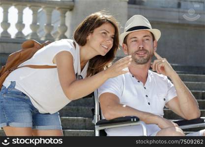 couple on holiday man in wheelchair