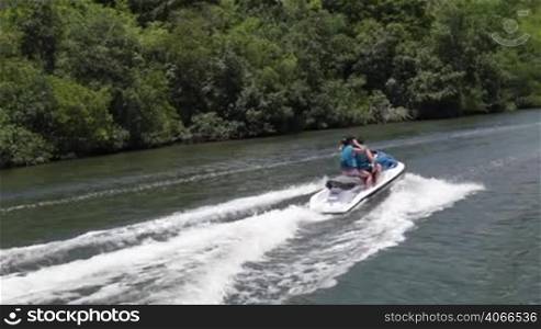 Couple on jet ski. Water scooter
