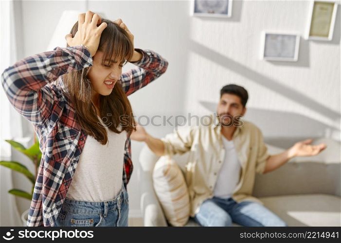 Couple on psychotherapist counseling session. Husband yelling on wife. Marriage or sexual problem. Young couple on counseling session with psychotherapist