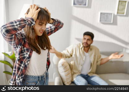 Couple on psychotherapist counseling session. Husband yelling on wife. Marriage or sexual problem. Young couple on counseling session with psychotherapist