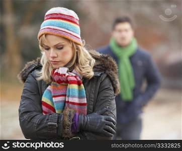 Couple On Romantic Winter Walk Through Frosty Landscape