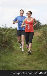 Couple On Run In Countryside