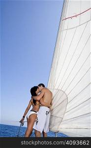 Couple on sail boat, kissing