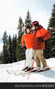 Couple on Skis on Mountain Slope
