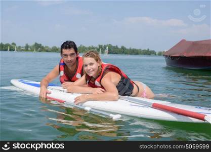 Couple on surfing board